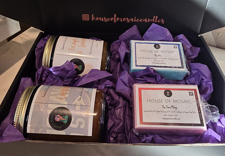 Assorted House of Mosaic gift box set including candles and matches, perfect for community gifting.